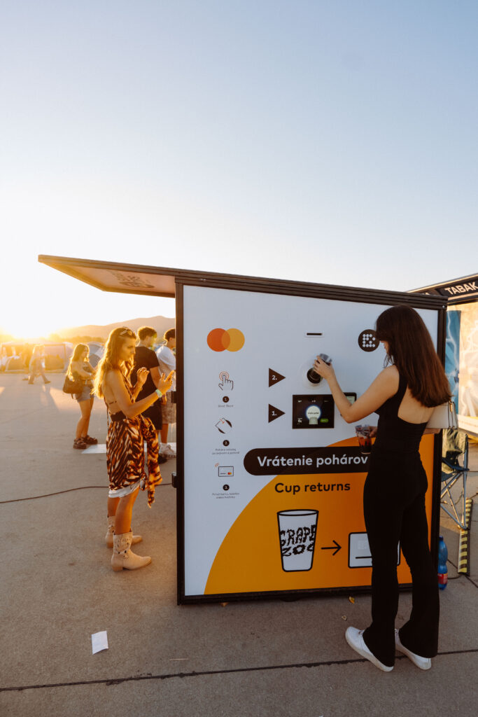 Visitor inserting a reusable cup into a Smart DRS Dual station at Grape Festival 2026