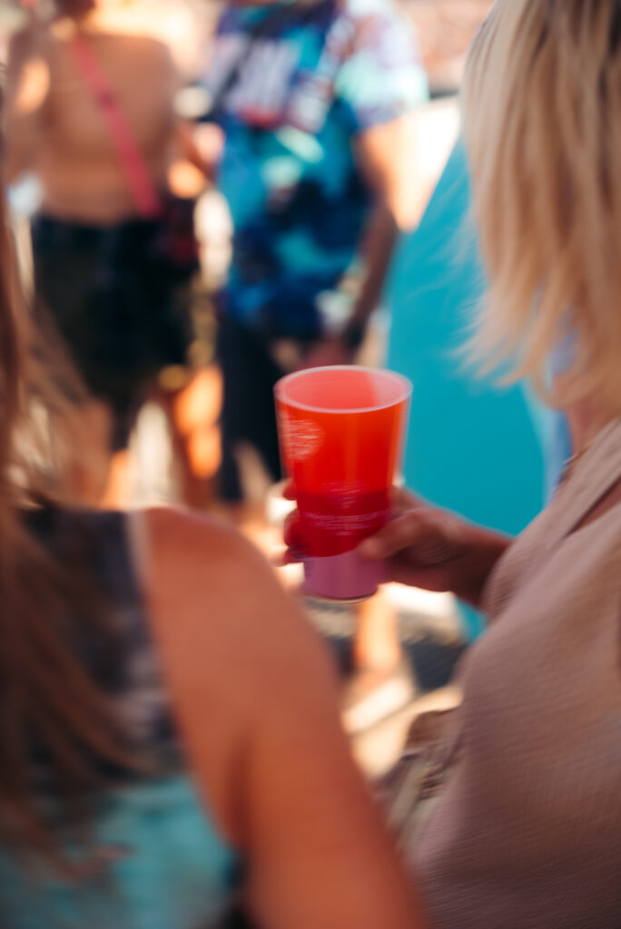 Festival visitor holding a reusable cup at LOVESTREAM Festival 2026.