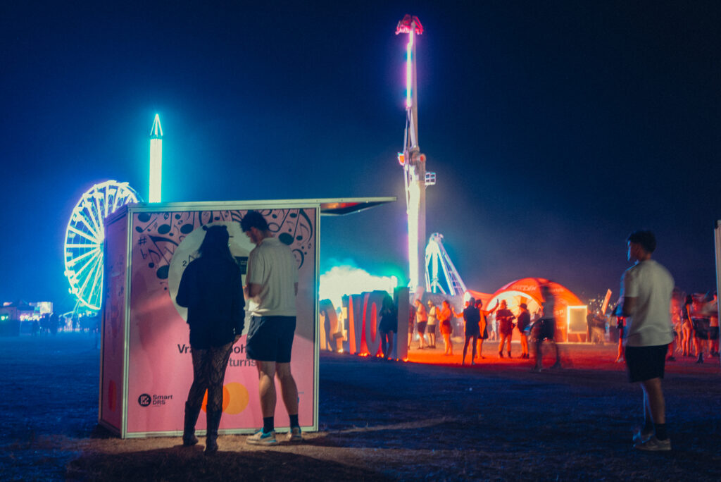 Festival visitor using a Smart DRS reusable cup return station at LOVESTREAM music festival 2026.