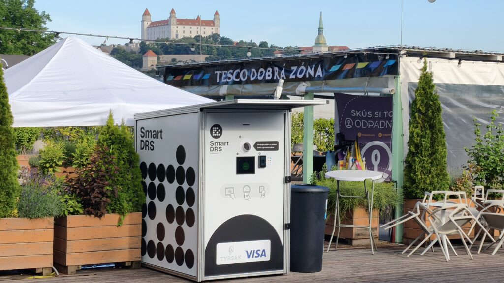 Smart DRS return station at Tyršák in Bratislava, with Bratislava Castle in the background.